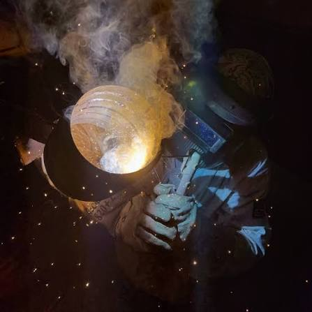 Kyle Gandini welding at KWI